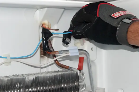 PHOTO: Clip the defrost bi-metal in place.