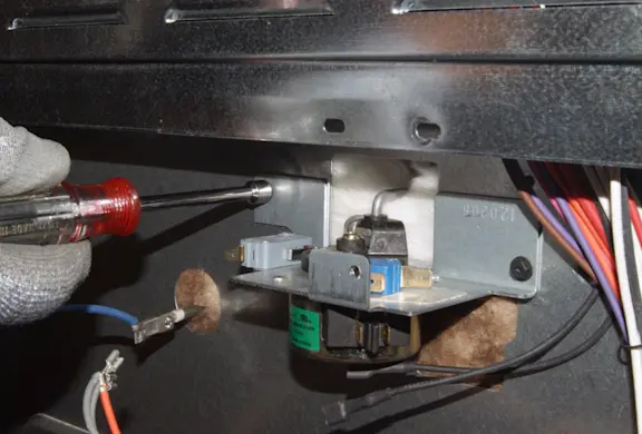 PHOTO: Remove the mounting screws.