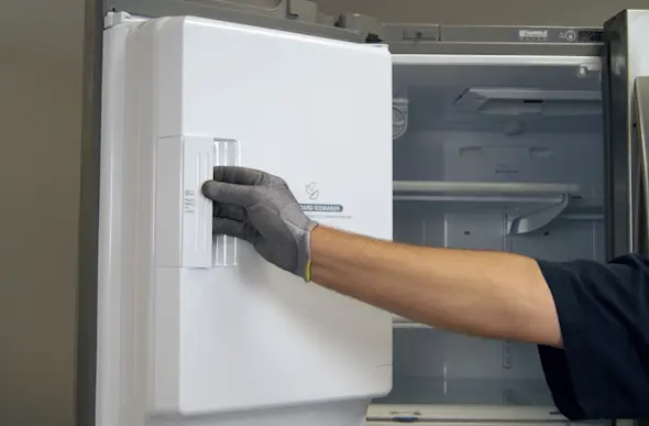 PHOTO: Open the door to the ice maker.