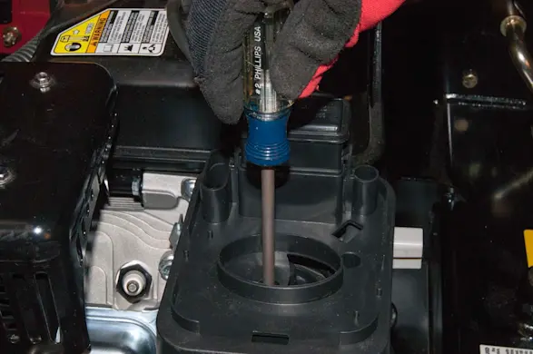 PHOTO: Reinstall the silencer plate mounting screws.