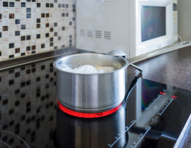 How is cooking on an electric range different than cooking on a gas stove?