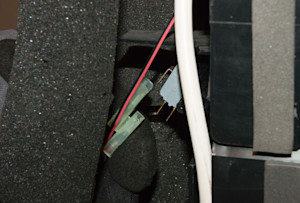 Disconnect the wire harness from the collection bucket float switch.
