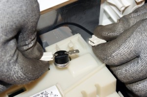 PHOTO: Remove the wires from the thermal fuse.