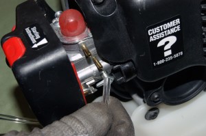 PHOTO: Connect the fuel lines to the carburetor.
