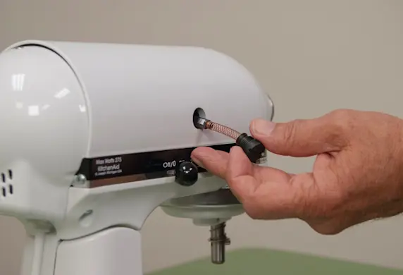 PHOTO: Install the new motor brush.