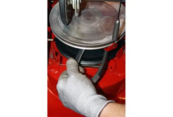 PHOTO: Remove the belt from the auger pulley.