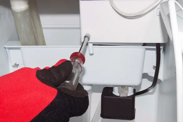 PHOTO: Reinstall the recirculation pump shield.