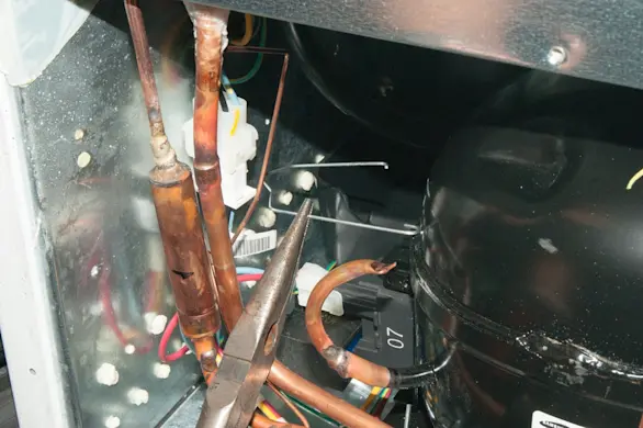 PHOTO: Reinstall the wire retainer.