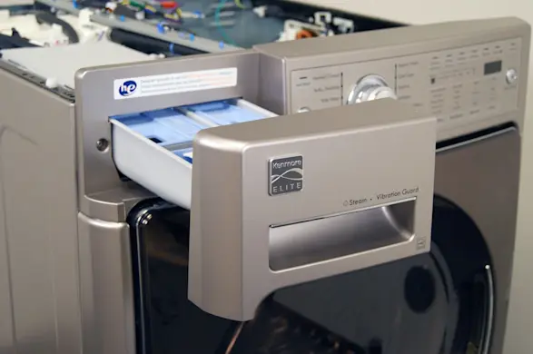 PHOTO: Pull the dispenser drawer out.