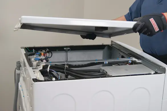 PHOTO: Reinstall the washer top panel.