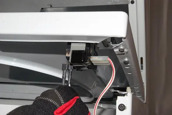 PHOTO: Disconnect the lid lock switch wires.