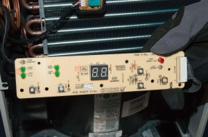 PHOTO: Lift the user interface control board out of the grille.