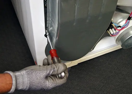 PHOTO: Remove the air duct mounting screws.