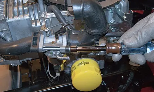PHOTO: Remove the carburetor.