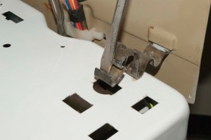 PHOTO: Reinstall the spring clips at the top of the washer cabinet.
