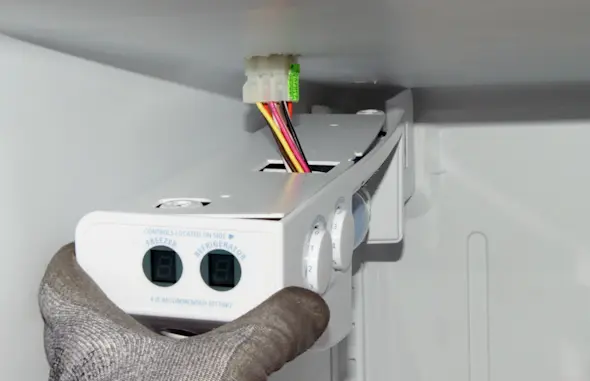 PHOTO: Pull down the control housing.