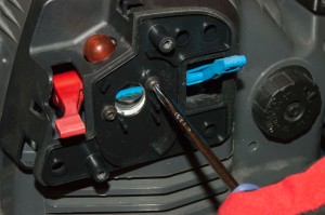 PHOTO: Remove the carburetor mounting screws.