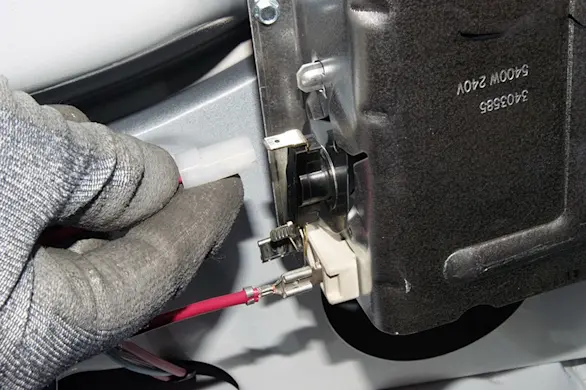 PHOTO: Disconnect the wire from the high-limit thermostat.