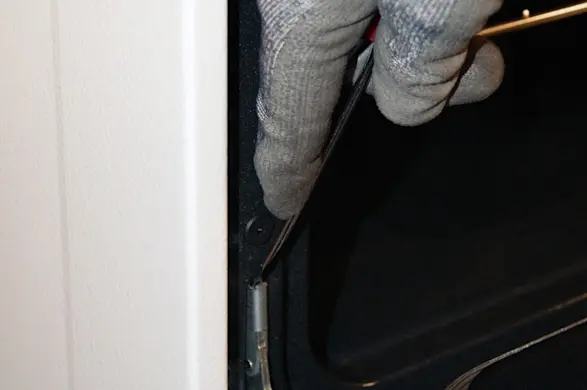 PHOTO: Release the locking tabs.