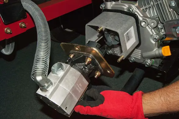 PHOTO: Remove the pump from the engine.