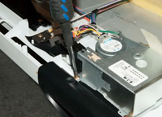 PHOTO: Remove the mounting screws.