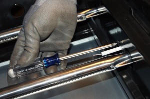 PHOTO: Remove the mounting screw that holds the igniter electrode in place.