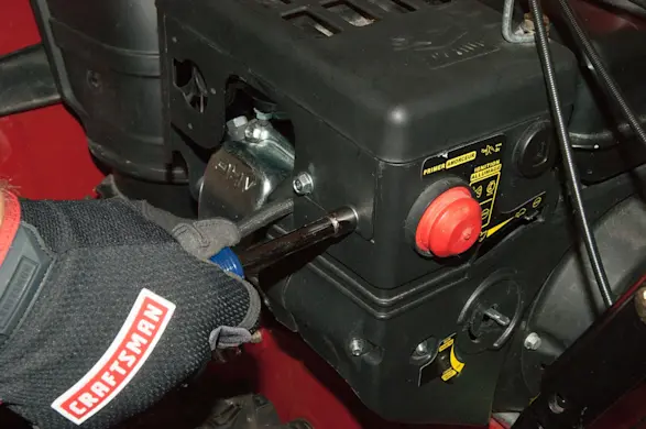 PHOTO: Remove the muffler shroud screws.