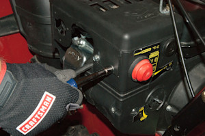 Remove the muffler shroud screws.