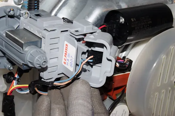 PHOTO: Open the wire harness plug cover.