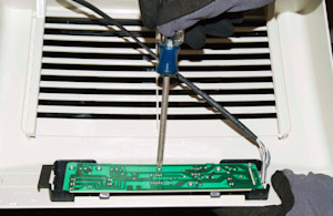 Remove the mounting screws.