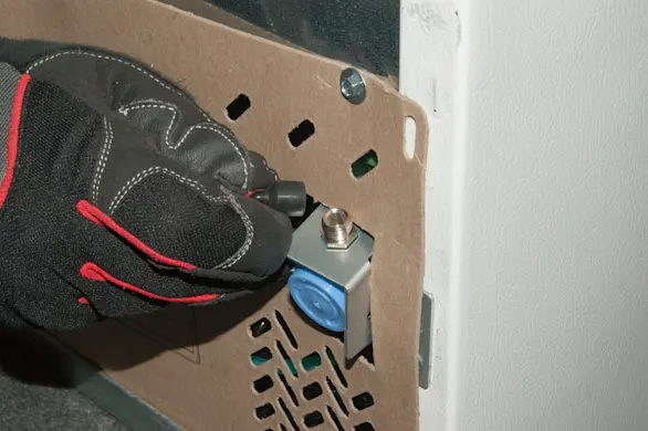 PHOTO: Remove the black rubber cap.