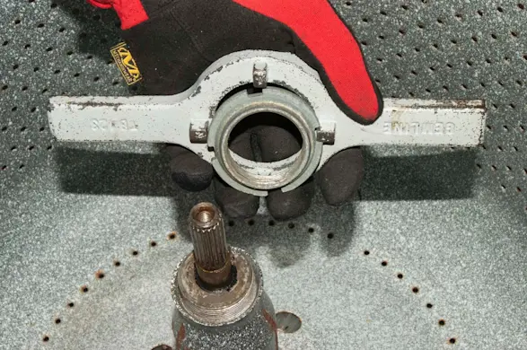 PHOTO: Remove the spanner nut from the shaft.