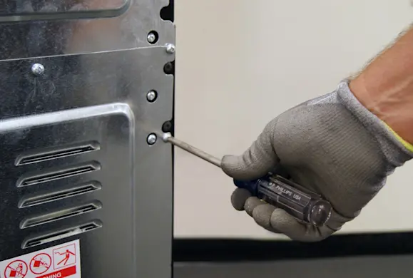 PHOTO: Remove the back panel screws.