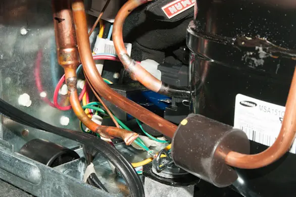 PHOTO: Plug in the new capacitor.