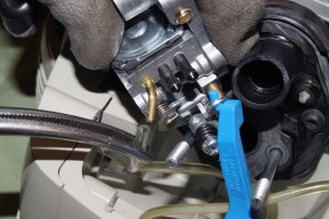 PHOTO: Pull the fuel lines off of the carburetor.