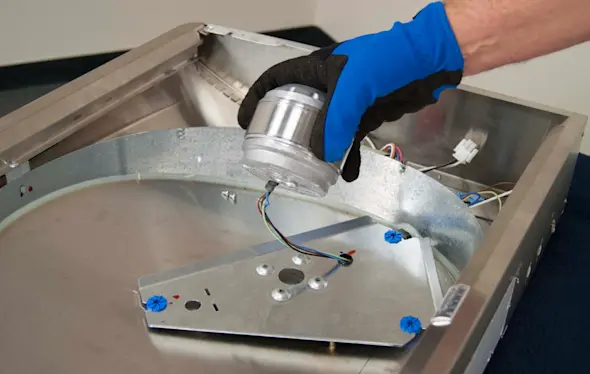PHOTO: Remove the motor from the mounting plate.