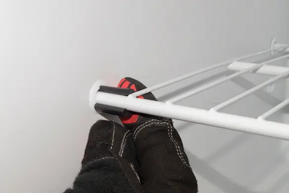 PHOTO: Reinstall the shelf spacer.