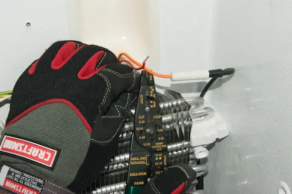 PHOTO: Strip the insulation from the wire ends.