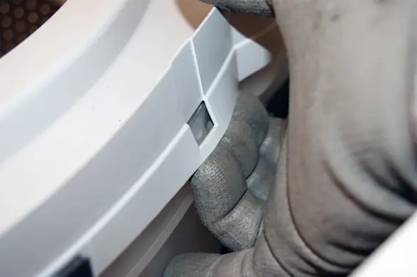 PHOTO: Release the tub ring locking tabs.