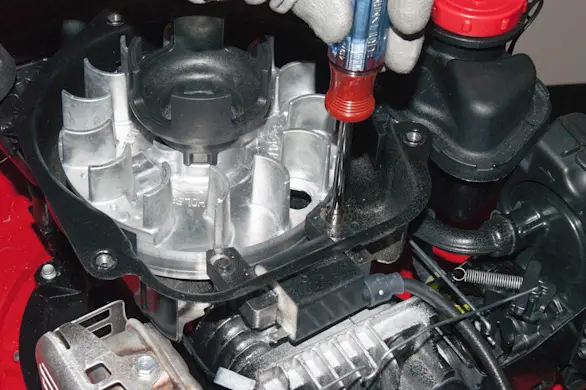 PHOTO: Remove the ignition coil screws.