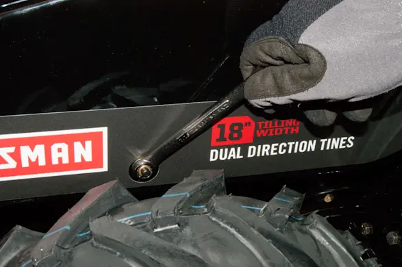 PHOTO: Remove the drive belt cover nut.