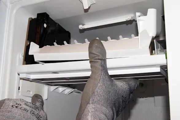 PHOTO: Slide the ice maker onto its rails.