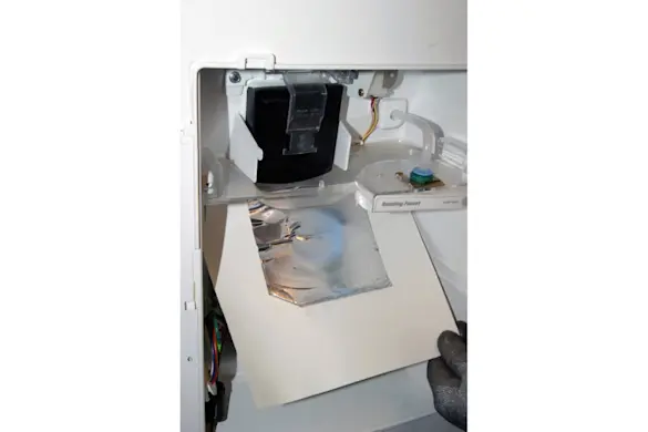 PHOTO: Lift the plastic cover.