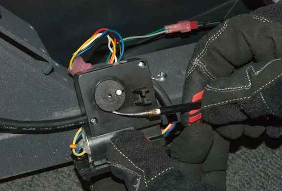 PHOTO: Slide the cable into the motor housing.