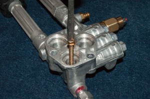 PHOTO: Insert a screw into the check valve body.