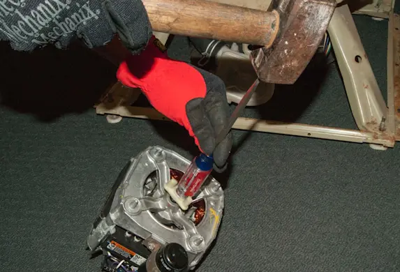 PHOTO: Install the new motor coupler cogs.