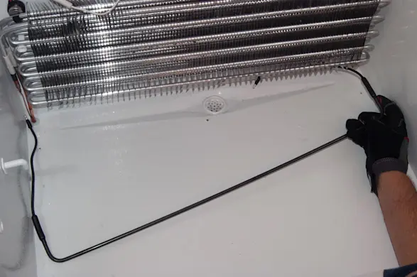 PHOTO: Pull the defrost heater out.