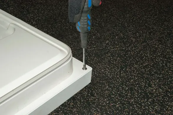 PHOTO: Remove screws from the inner door panel.