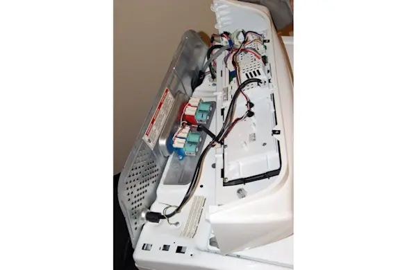 PHOTO: Lay the console on top of the washer.