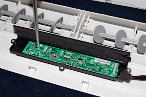 Reinstall the user interface mounting screws.
